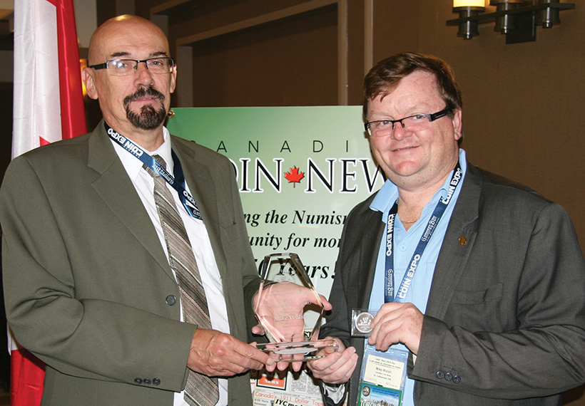 Mike Walsh receiving his presidential award from RCNA
						President Bret Evans