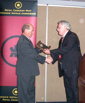 Chuck Moore presenting a Presidential Award to David Dingwall on behalf of the Royal Canadian Mint