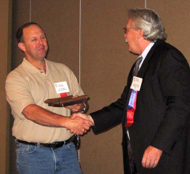 Vic Schoff receiving a Special Appreciation Award from Charles Moore, President of the C.N.A.