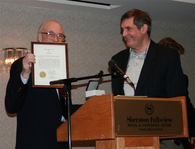 Ron Greene presenting the J. D. Ferguson Award to Warren Baker