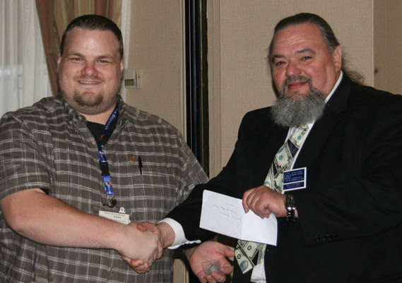 Brent Mackie, Waterloo Coin Society, receiving Louise Graham Memorial Club of the Year Award for 2009 from Bill Waychison