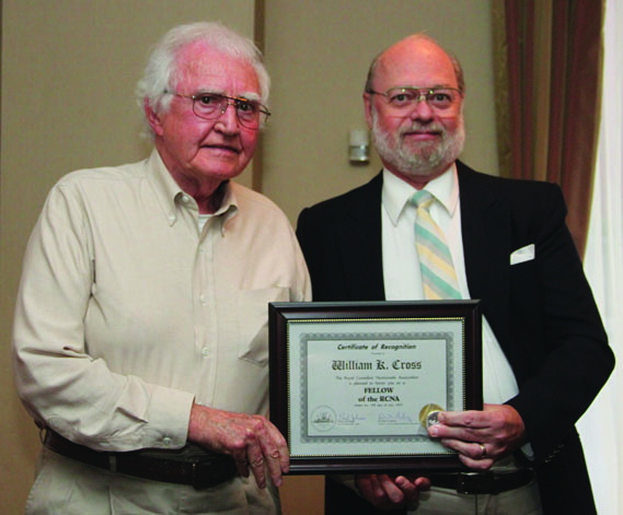 (left to right) W. K. Cross receiving a Fellow of The Royal Canadian Numismatic Association Award from Tim Henderson