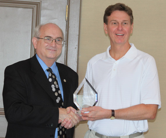 James Horkulak receiving a Presidential Award from Michael Walsh, President of the RCNA