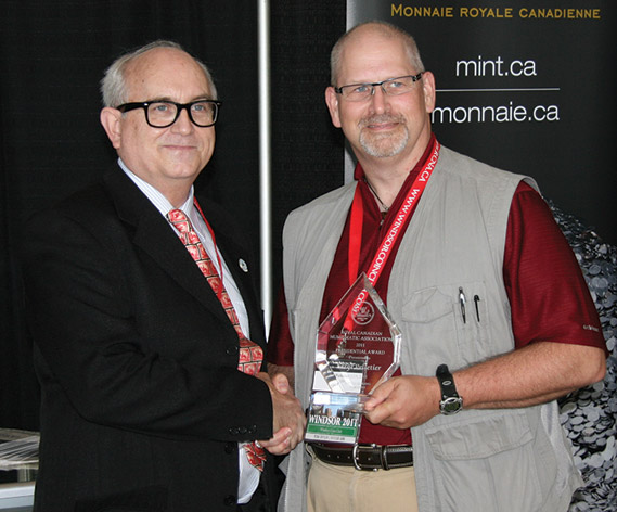 Serge Pelletier (right) receiving a Presidential Award from Dan Gosling, President of the RCNA 