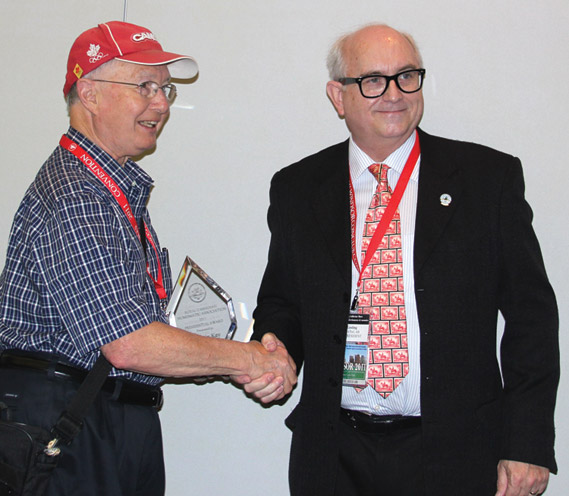 Dr. Marvin Kay (left) receiving a Presidential Award from Dan Gosling, President of the RCNA