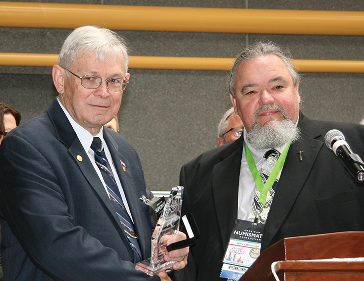 Clifford Mishler receiving his presidential award from RCNA
						Past President William Waychison