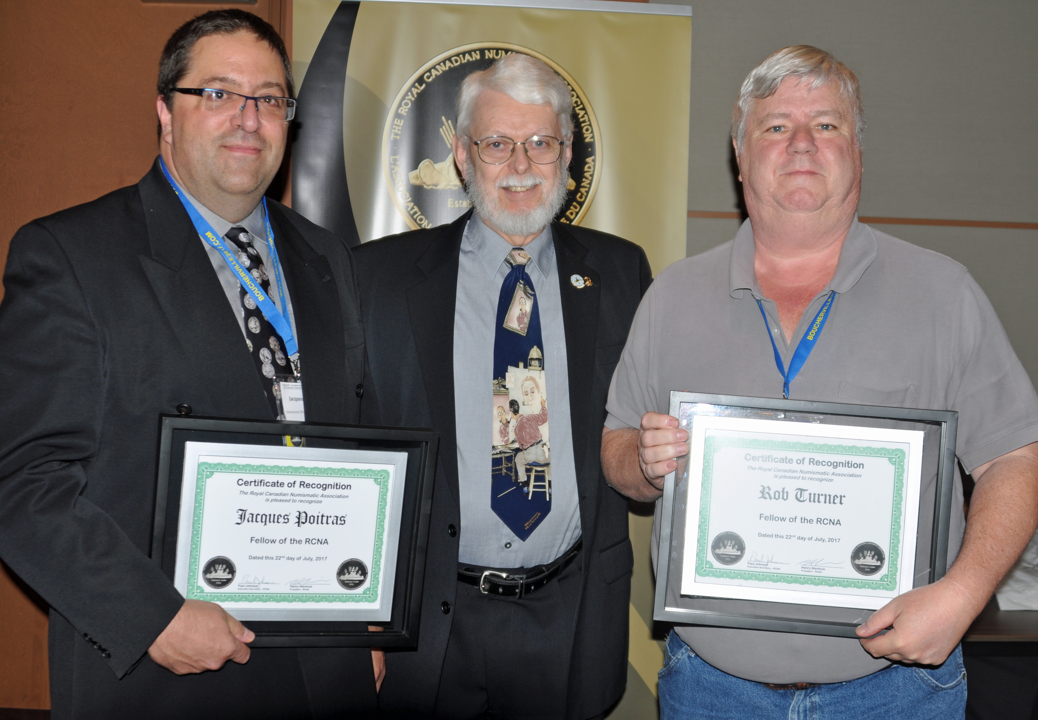 <p><strong>Jacques Poitras</strong> (left) and <strong>Rob Turner</strong> (right) receiving the Fellow Award from <strong>Paul Petch</strong> (center).</p>
<p>Photo courtesy Jeff Fournier.</p>