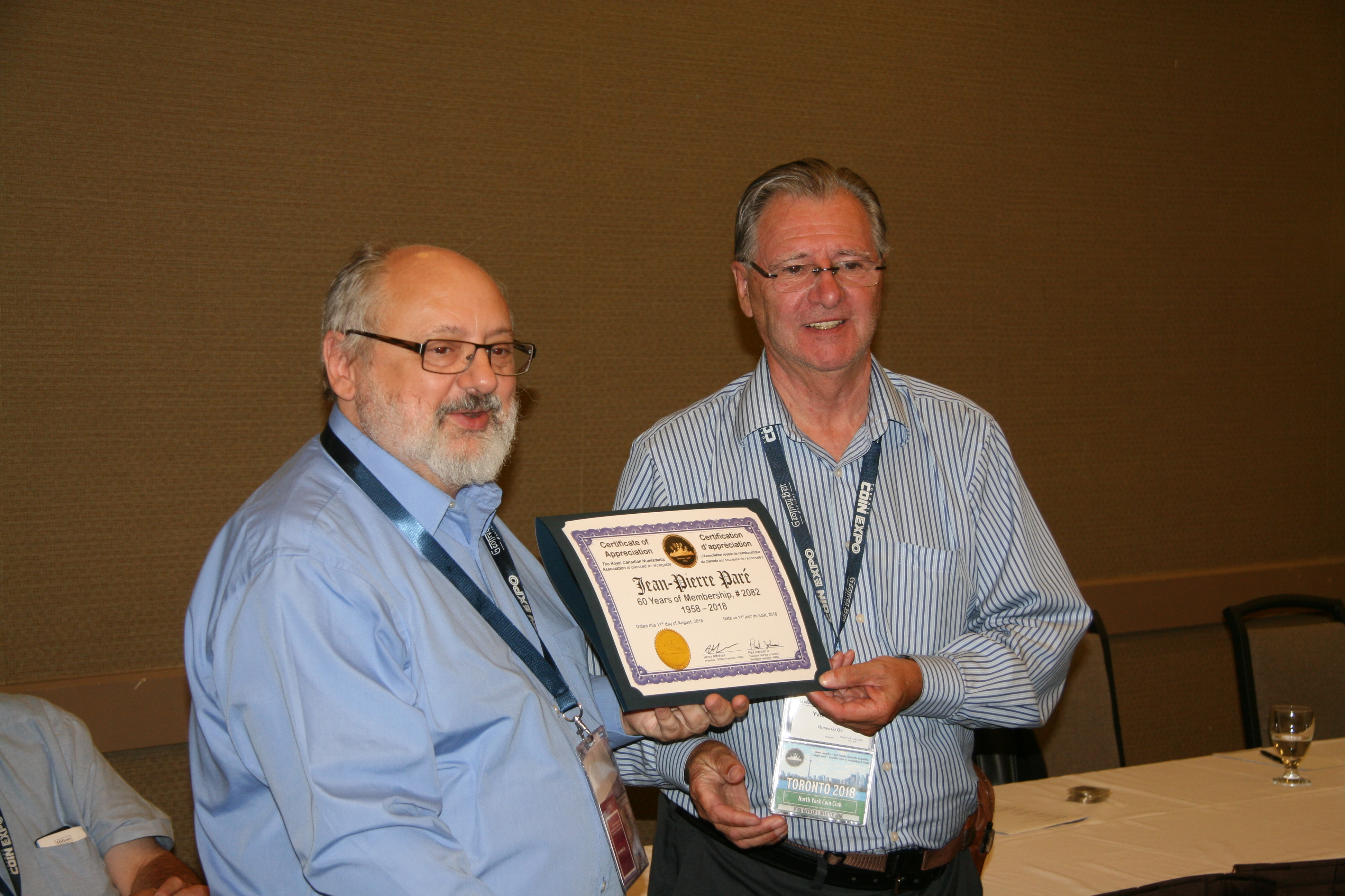 <p><strong>Yvon Marquis</strong> (right) receiving his 40 years of membership recognition award from <strong>Henry Nienhuis</strong> (left).<br> <small>Dan Gosling photo</small></p>