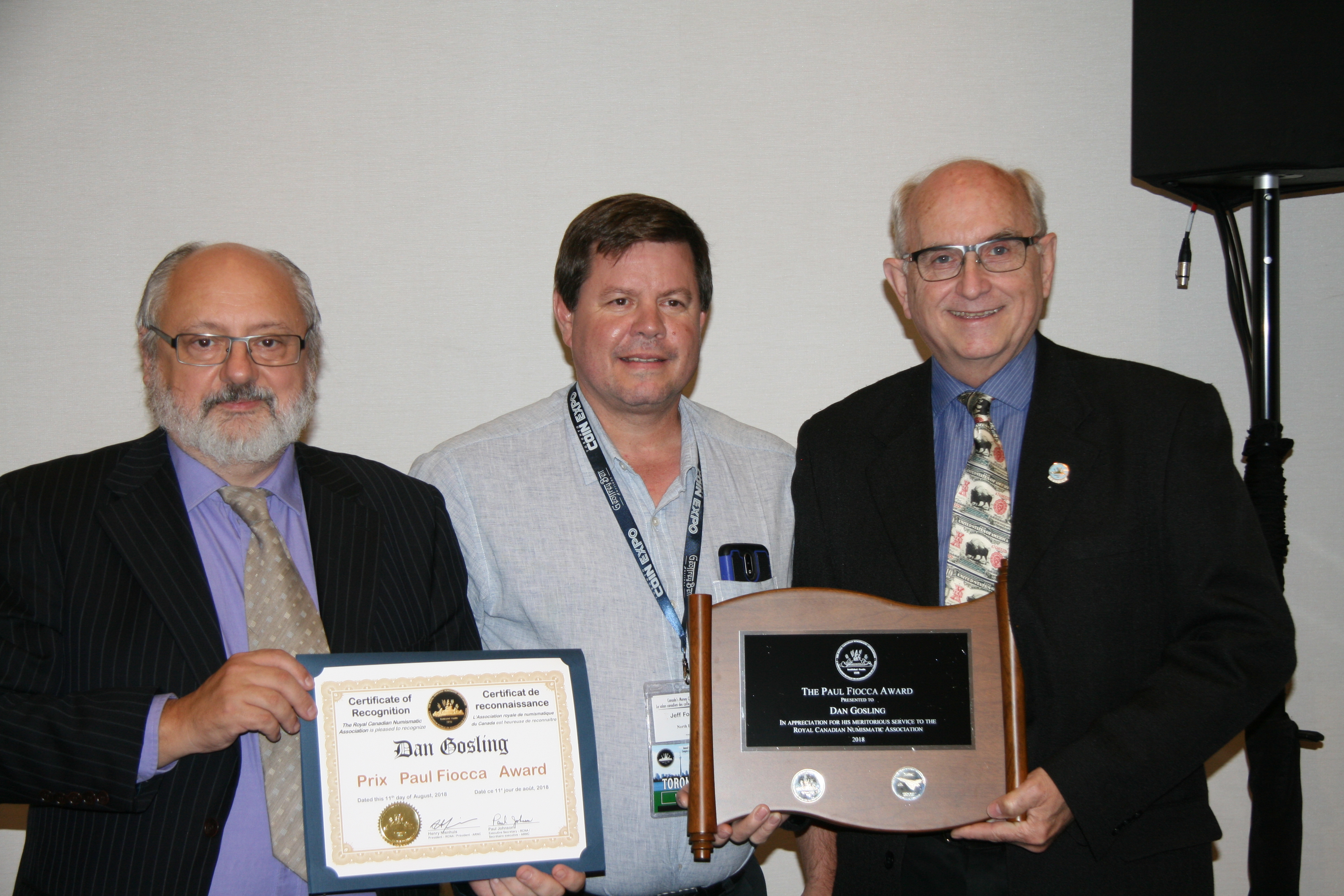 <p><strong>Dan Gosling</strong> (left) receiving the Paul Fiooca Award from <strong>Henry Nienhuis</strong> (left) and Trajan Publications, represented by <strong>Jeff Fournier</strong> (center).<br /> <small>J. Scott photo</small></p>